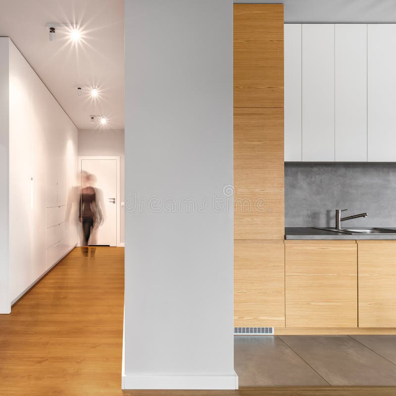 Long modern hallway next to kitchen royalty free stock image